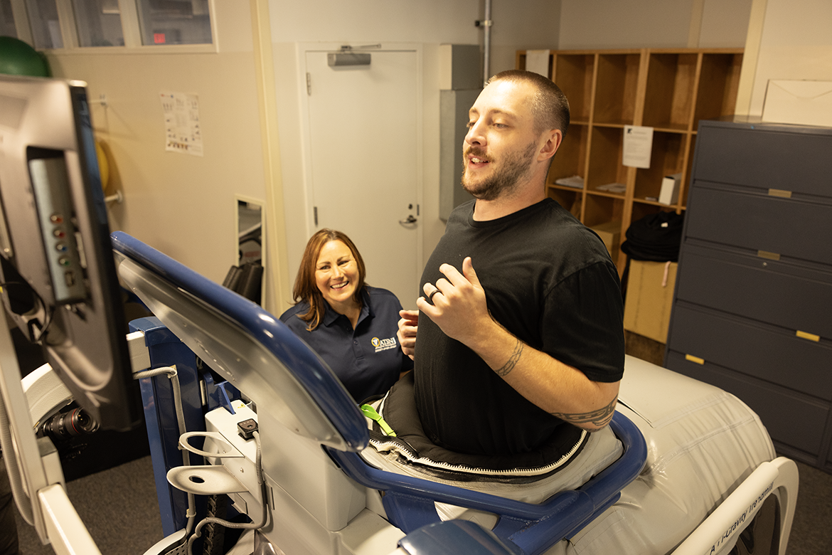 AT Aids Athlete on Alter G Treadmill